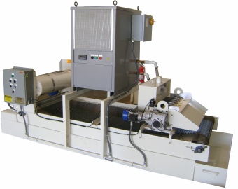 Magnetic/paper bed grinding filter features space saving top mount open-loop coolant chiller.